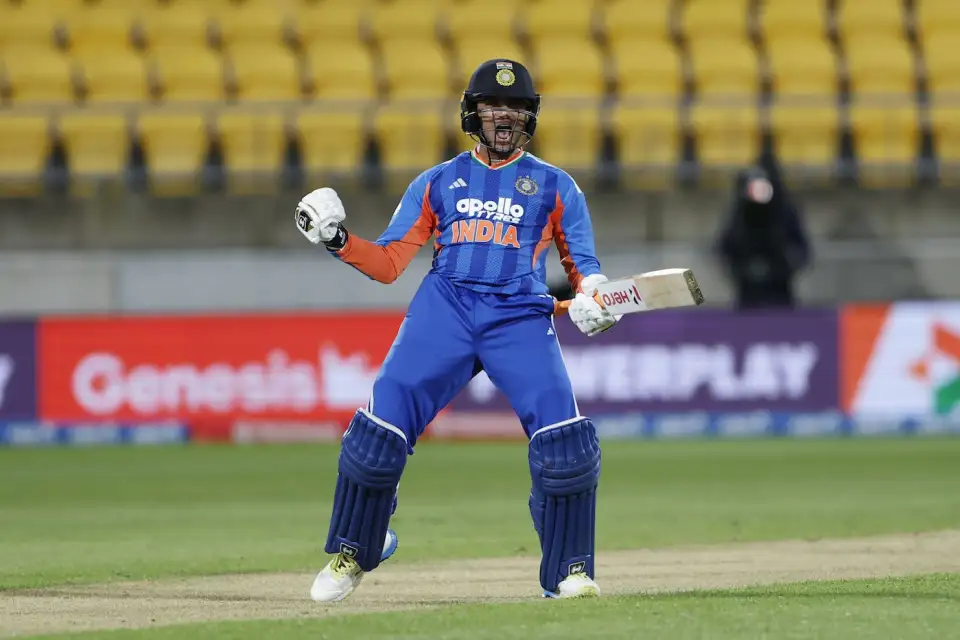 Abhishek Sharma celebrating his explosive century while batting for India in a T20 international match.