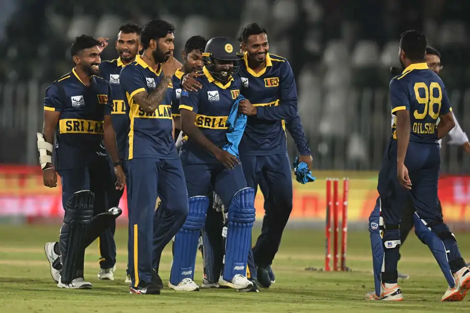 Sri Lankan cricket players celebrating together on the pitch after completing the record 429 run chase against England